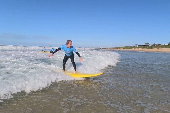 2 Hour Private Surf Lesson Experience in Wollongong - In the water: coach help for standing up and wave testing